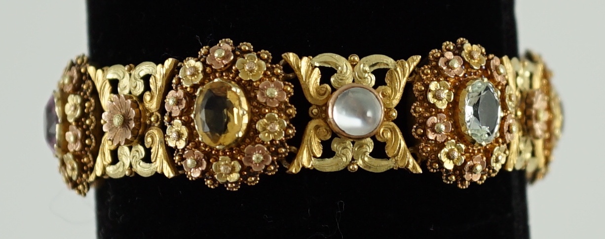 A 19th century pierced three colour gold, pink topaz, moonstone, citrine and aquamarine set bracelet.